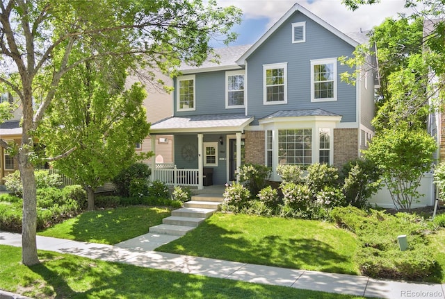 7860 E Ellsworth Ave, Denver, CO 80230 - traditional home with a porch, a front lawn, brick siding, and roof with shingles