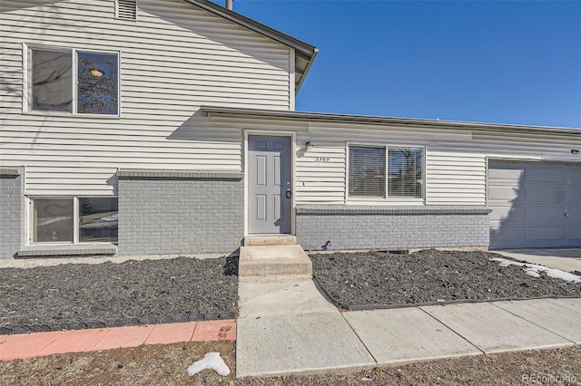 doorway to property featuring a garage