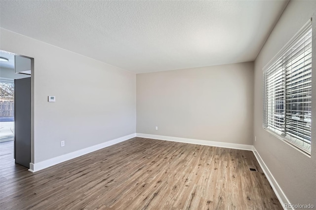 empty room featuring wood-type flooring