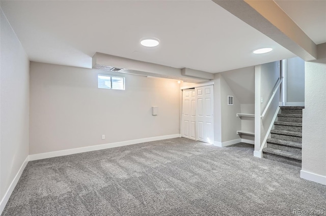 basement featuring carpet flooring