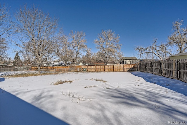 view of yard layered in snow