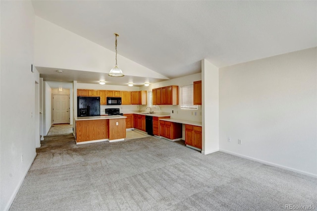 kitchen with decorative light fixtures, sink, a center island, black appliances, and light carpet