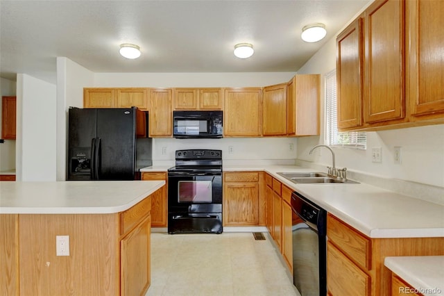 kitchen featuring sink and black appliances