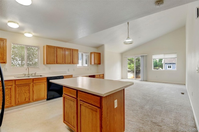 kitchen with a kitchen island, dishwasher, sink, hanging light fixtures, and light colored carpet