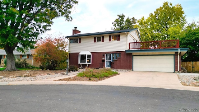 view of front of house with a balcony and a garage