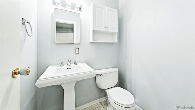 bathroom with tile patterned floors and toilet