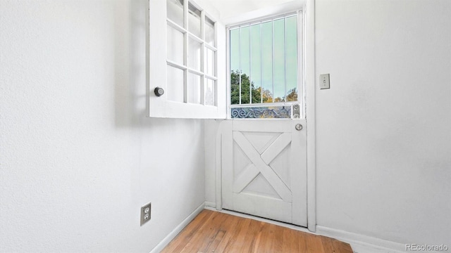 doorway to outside with hardwood / wood-style floors