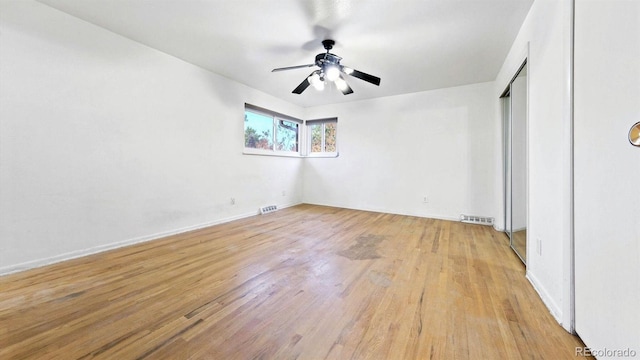 unfurnished bedroom featuring light hardwood / wood-style flooring and ceiling fan