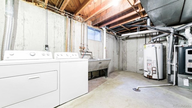 basement with washer and dryer and water heater