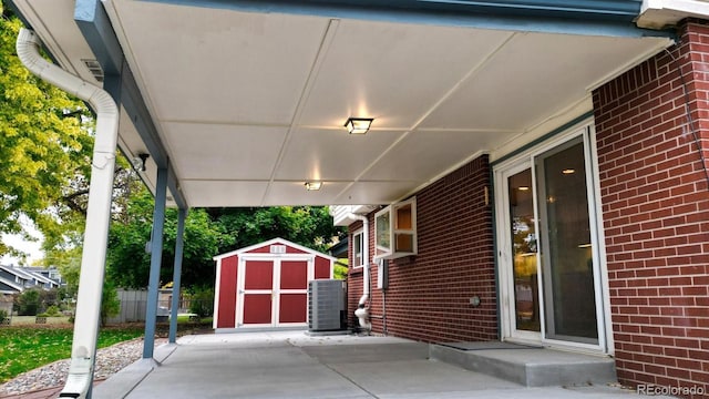 view of patio / terrace with a storage unit and central air condition unit