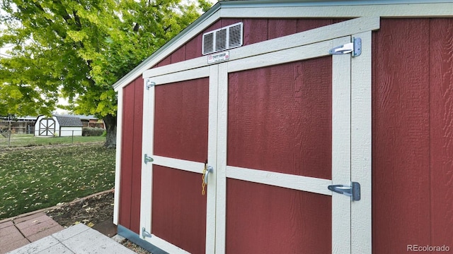 view of outdoor structure featuring a yard