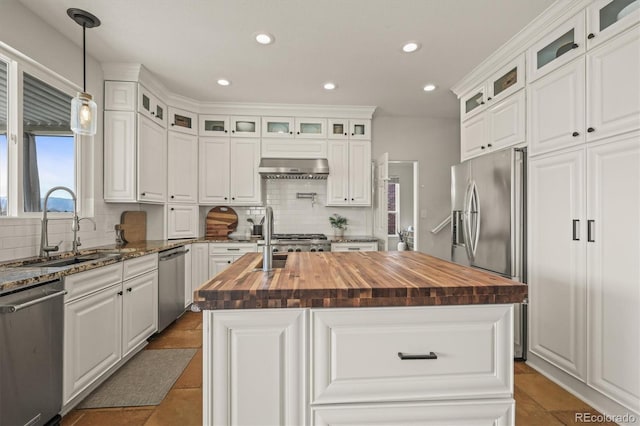 854 Countrybriar Ln, Highlands Ranch, CO 80129 - kitchen featuring wooden counters, appliances with stainless steel finishes, tasteful backsplash, an island with sink, and recessed lighting