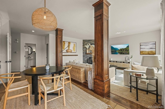 854 Countrybriar Ln, Highlands Ranch, CO 80129 - dining space with ornate columns and wood finished floors