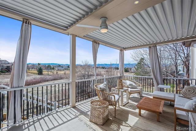 854 Countrybriar Ln, Highlands Ranch, CO 80129 - sunroom / solarium featuring a mountain view, ceiling fan, and an outdoor living space