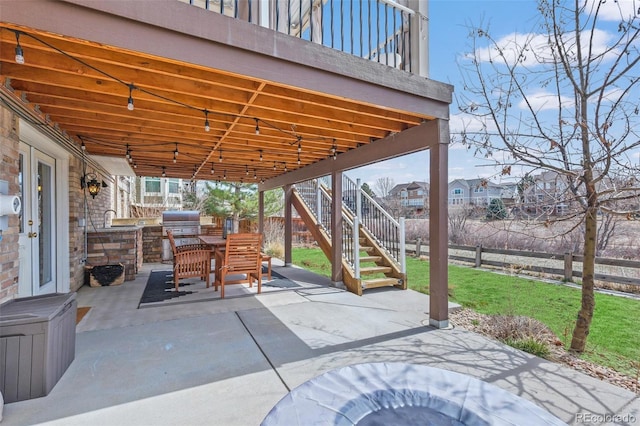 854 Countrybriar Ln, Highlands Ranch, CO 80129 - fenced backyard featuring a patio area, an outdoor kitchen, and stairway