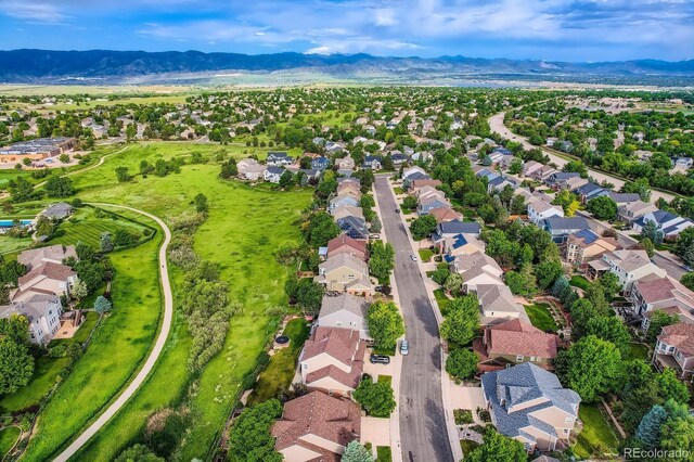 854 Countrybriar Ln, Highlands Ranch, CO 80129 - aerial perspective of suburban area with a mountainous background