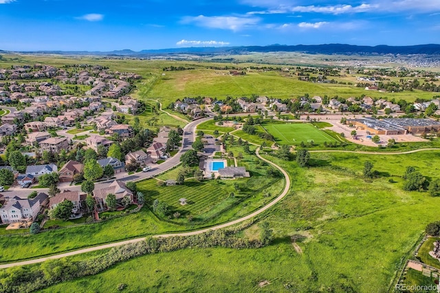854 Countrybriar Ln, Highlands Ranch, CO 80129 - aerial overview of property's location with mountains and nearby suburban area