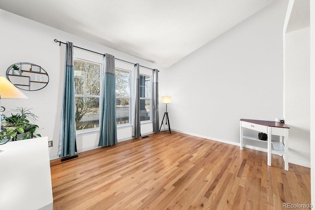 2730 River View Dr, Broomfield, CO 80023 - spare room with vaulted ceiling, light wood-style floors, and baseboards