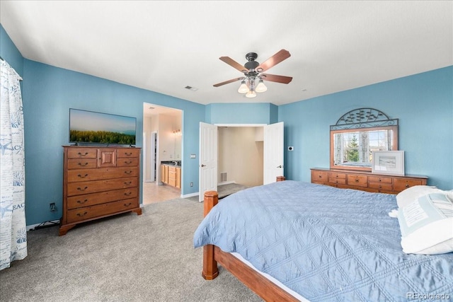 2730 River View Dr, Broomfield, CO 80023 - bedroom featuring light carpet, ensuite bath, a ceiling fan, and baseboards