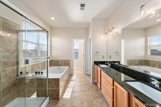 2730 River View Dr, Broomfield, CO 80023 - full bathroom with a bath, double vanity, a shower stall, and tile patterned floors