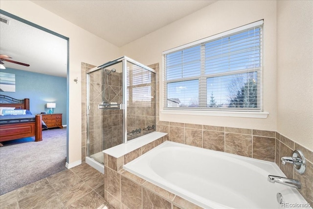 2730 River View Dr, Broomfield, CO 80023 - ensuite bathroom with a bath, a stall shower, and a ceiling fan