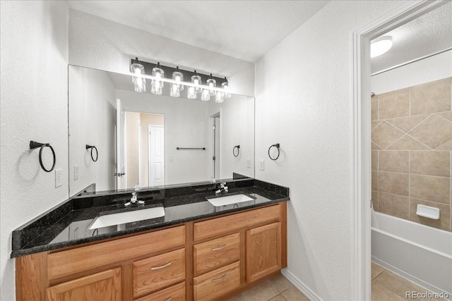 2730 River View Dr, Broomfield, CO 80023 - bathroom featuring double vanity, tile patterned flooring, a textured wall, and bathing tub / shower combination