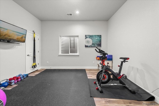 2730 River View Dr, Broomfield, CO 80023 - workout area featuring wood finished floors and baseboards