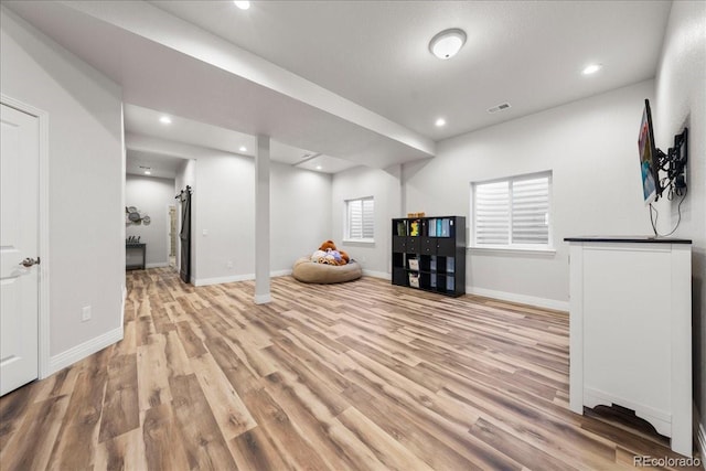 2730 River View Dr, Broomfield, CO 80023 - below grade area with light wood-style floors, baseboards, and recessed lighting