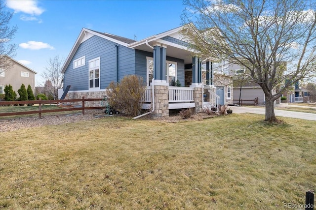 2730 River View Dr, Broomfield, CO 80023 - view of front facade featuring covered porch, stone siding, and concrete driveway