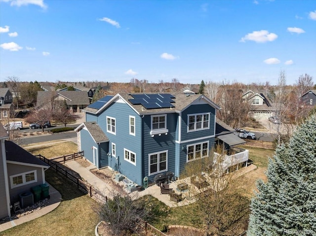2730 River View Dr, Broomfield, CO 80023 - back of property featuring solar panels, a residential view, central AC, and a patio