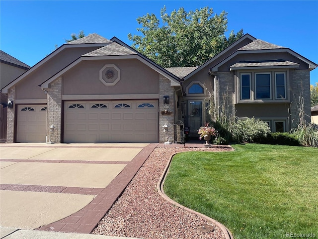 view of front facade with stucco siding, concrete driveway, a front yard, a garage, and stone siding