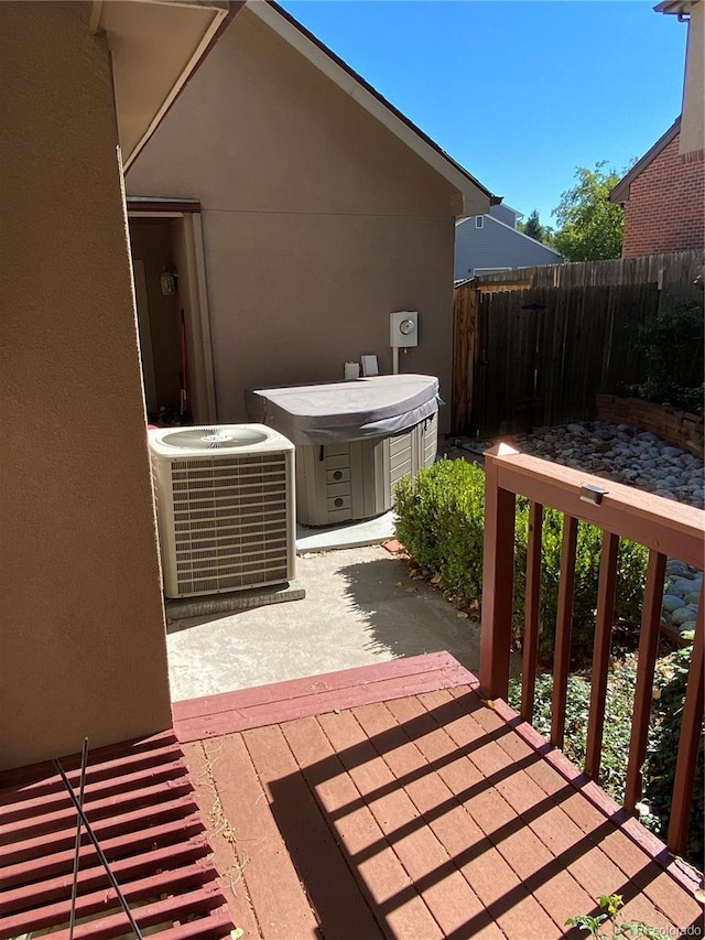 view of patio / terrace featuring central AC and fence