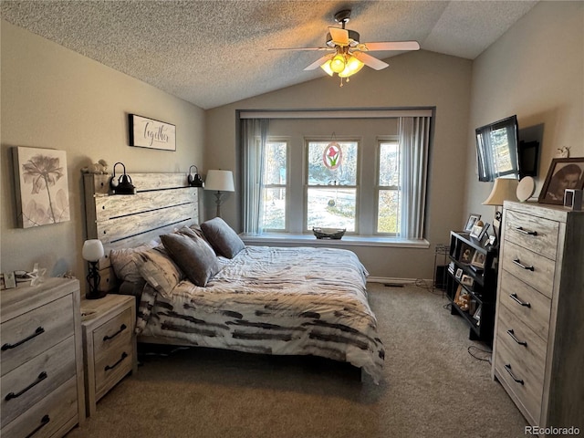 carpeted bedroom with a ceiling fan, vaulted ceiling, and a textured ceiling