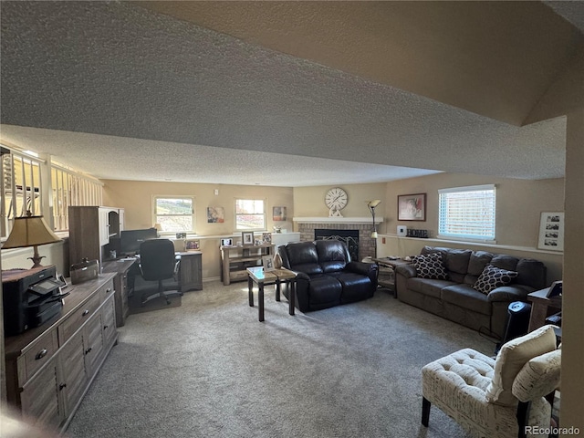 living room with light carpet, a textured ceiling, and a fireplace