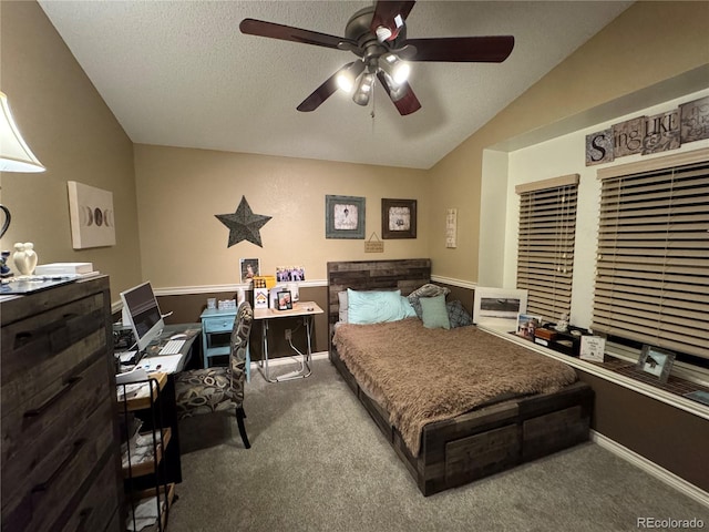 bedroom featuring carpet, vaulted ceiling, a textured ceiling, and baseboards