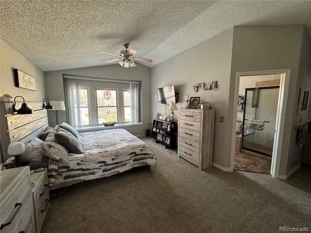 carpeted bedroom featuring baseboards, ensuite bath, ceiling fan, vaulted ceiling, and a textured ceiling