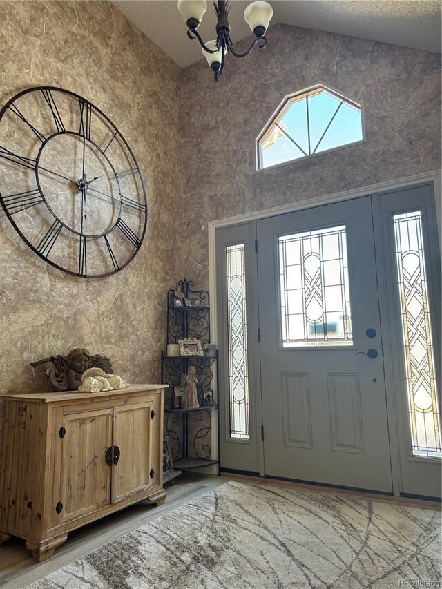 entrance foyer featuring a notable chandelier and a high ceiling