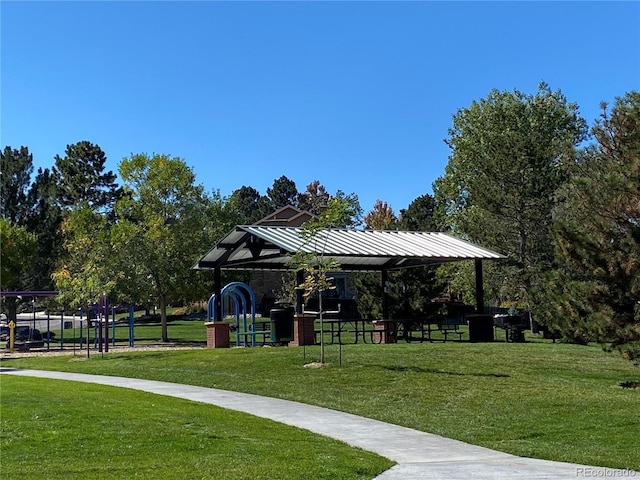 view of property's community featuring a yard and playground community