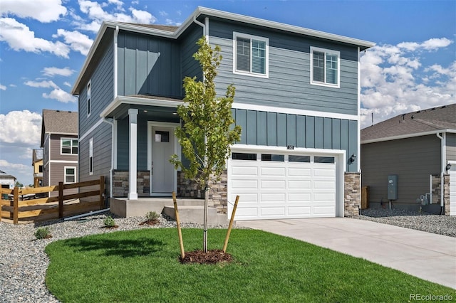 view of front of house with a garage and a front lawn