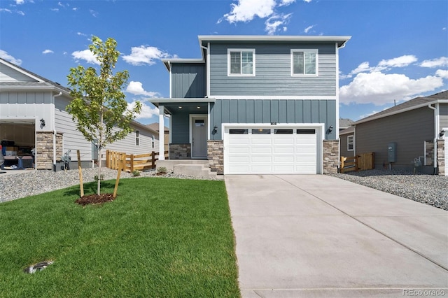 view of front facade with a front yard and a garage