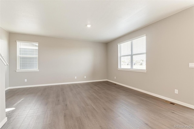 empty room featuring hardwood / wood-style floors