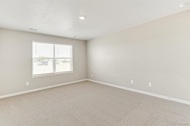 spare room featuring carpet flooring