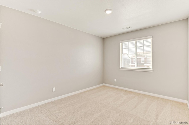 empty room featuring light colored carpet