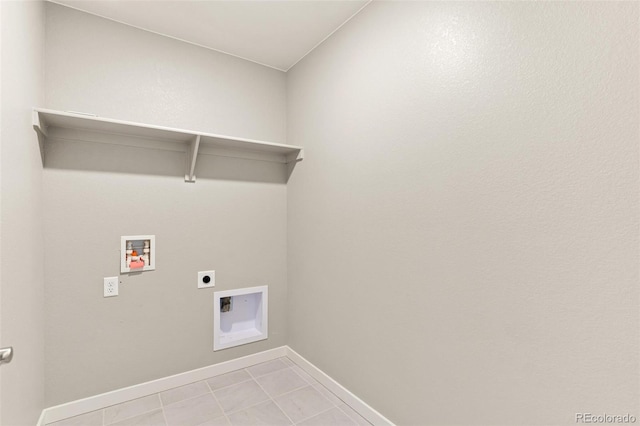 laundry room with hookup for an electric dryer, light tile patterned floors, and hookup for a washing machine