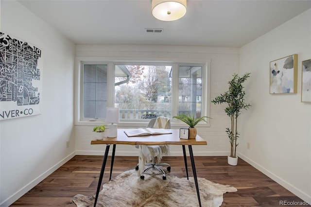 office with dark hardwood / wood-style flooring