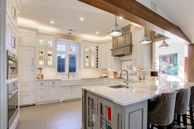 kitchen featuring plenty of natural light and hanging light fixtures