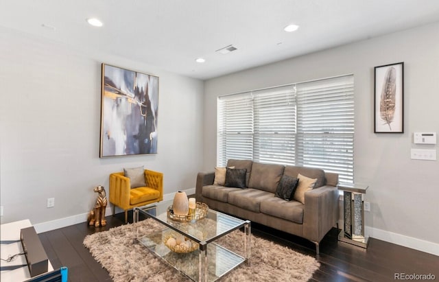 living room featuring dark hardwood / wood-style flooring