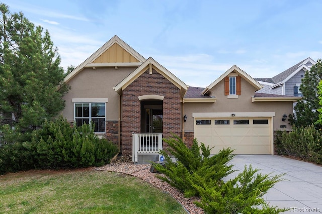 17223 W 84th Dr, Arvada, CO 80007 - view of front of property featuring stucco siding, driveway, an attached garage, stone siding, and a front lawn
