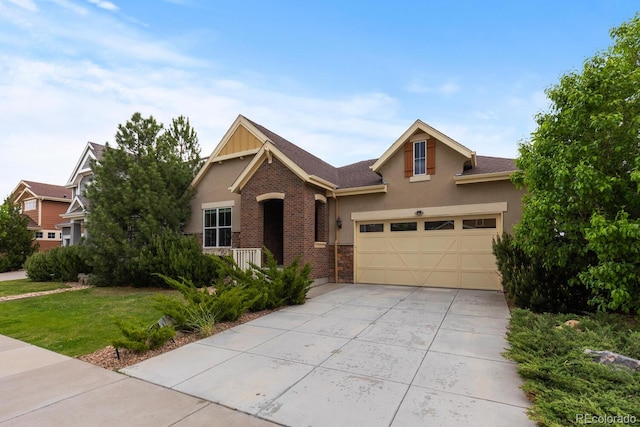 17223 W 84th Dr, Arvada, CO 80007 - view of front of house featuring driveway, stucco siding, an attached garage, a front yard, and stone siding
