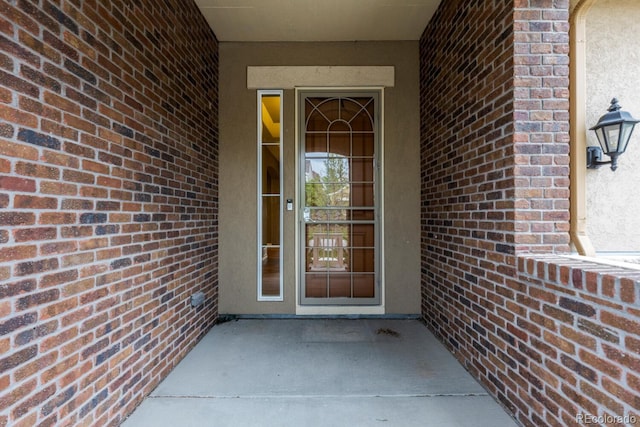 17223 W 84th Dr, Arvada, CO 80007 - property entrance featuring brick siding